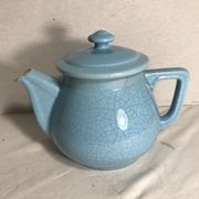 Cracked blue ceramic vintage teapot