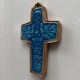 Ceramic cross with a blue background and bird decoration by Taburet Quimper, 20th century.