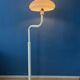Mid-century mushroom floor lamp with a white plexiglass shade.