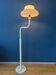 Mid-century mushroom floor lamp with a white plexiglass shade.