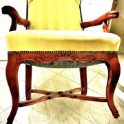 Wingback armchair in walnut in the French Regency style with stretcher in
