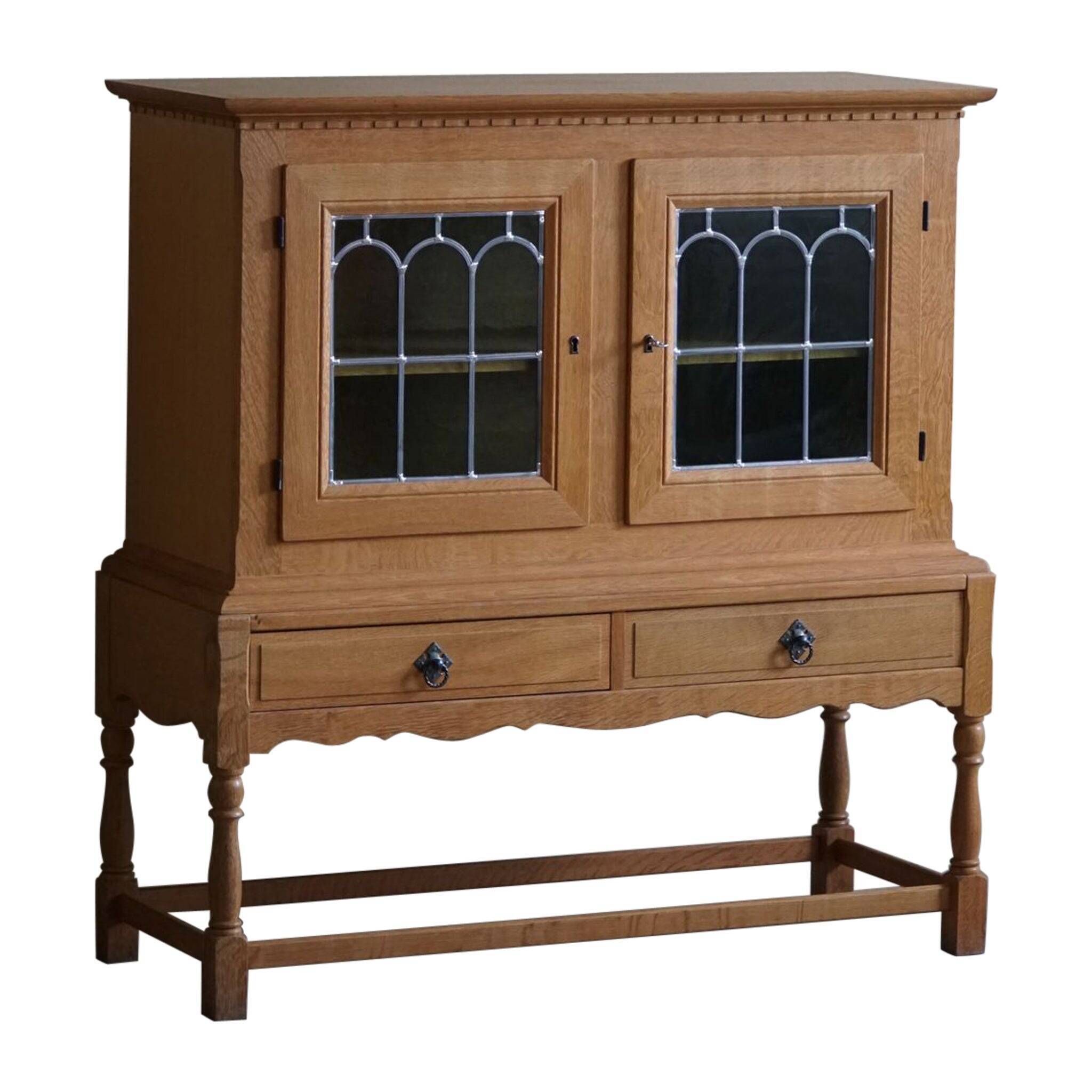 20th-century solid oak display cabinet with a glass front, by a Danish cabinetmaker.