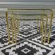 Nested table in gold metal and glass