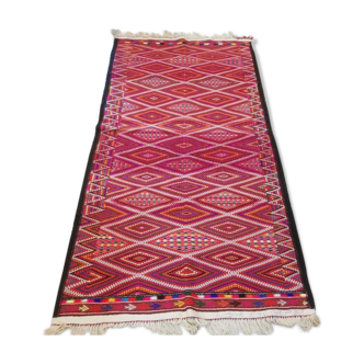 Red kilim carpet, handmade Moroccan wool rug.