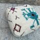 Berber floor pouf: Handwoven Moroccan wool cushion.