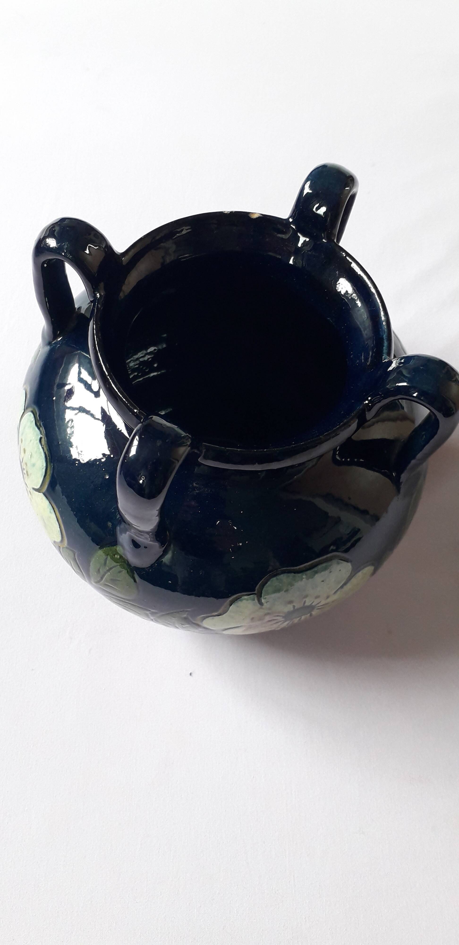 Antique Art Nouveau vase with floral decoration.