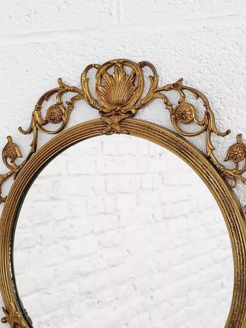 Round brass medallion style mirror