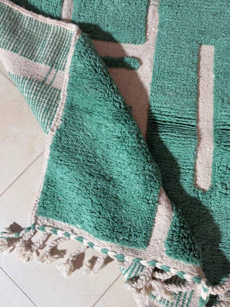 Beni Ourain Berber rug made of natural wool, traditionally handwoven.