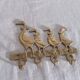 Wall-mounted tea towel holder or key holder in brass with ducks.