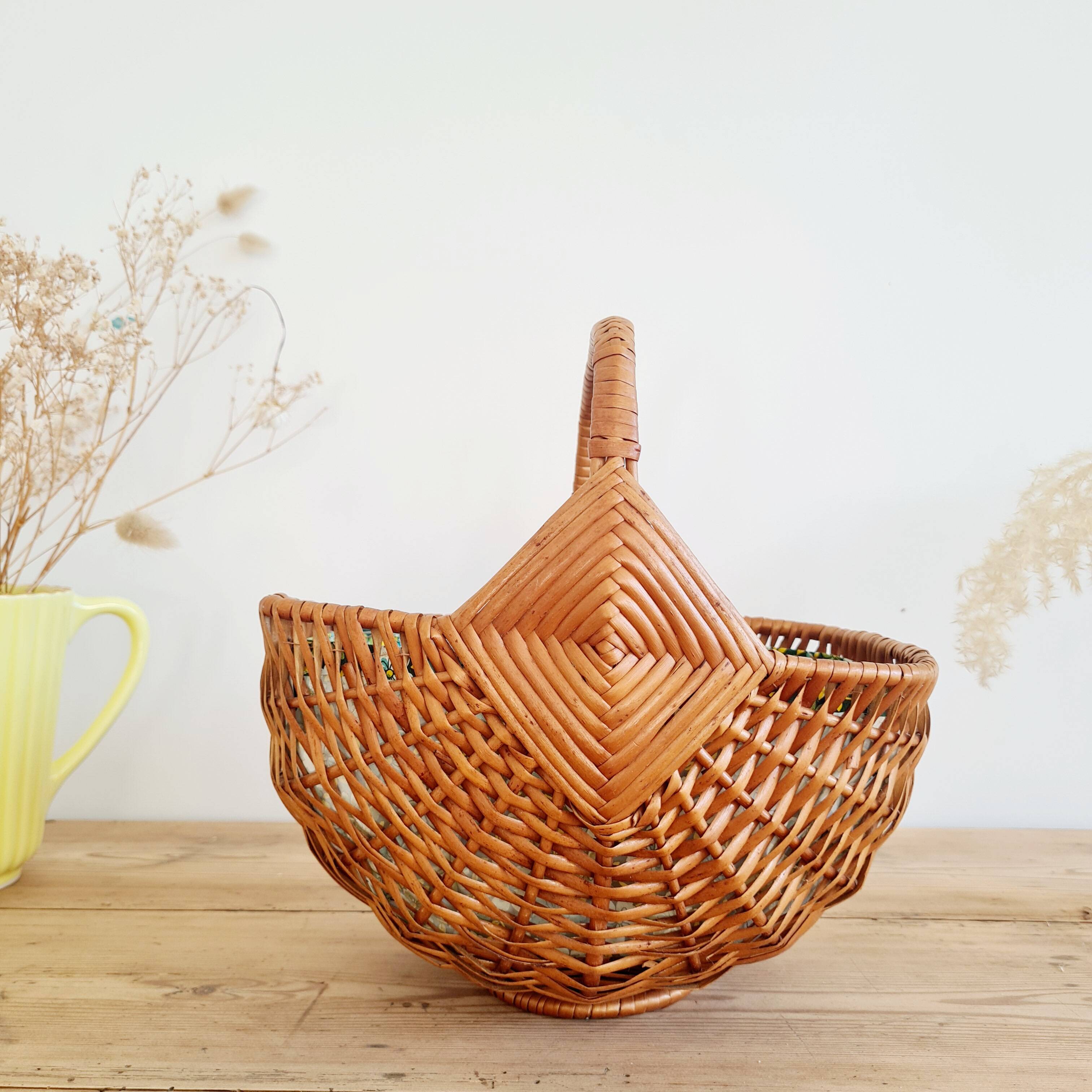Small old basket with floral fabric interior