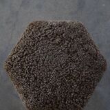 A hexagonal oak stool, seat refurbished in lambswool, Danish design from the 1950s.