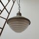 Patinated metal and glass Holophane pendant light