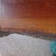 Tripod coffee table - solid okoumé wood - organic shape - brutalist style