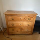 Rustic English pine chest of drawers with porcelain knobs.
