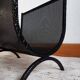 Cast iron magazine rack, circa 1950