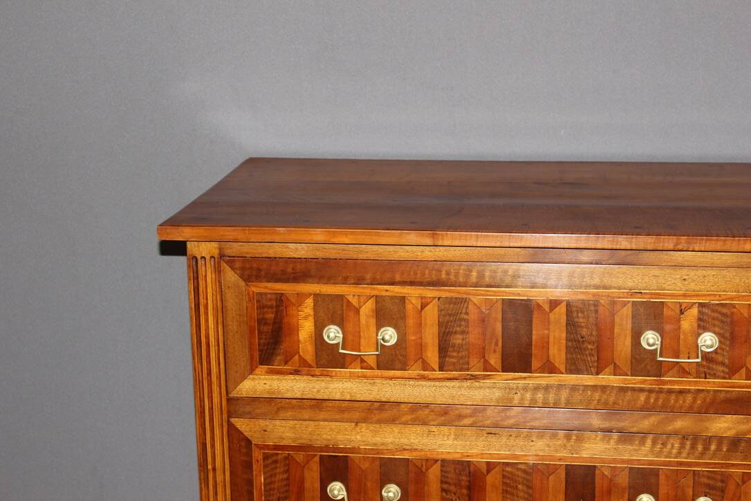 Louis XVI style chest of drawers in walnut and 19th century marquetry
