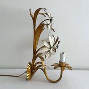 Vintage Hollywood Regency gold metal leaf wall sconce.