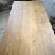 Oak farmhouse table with turned black legs.