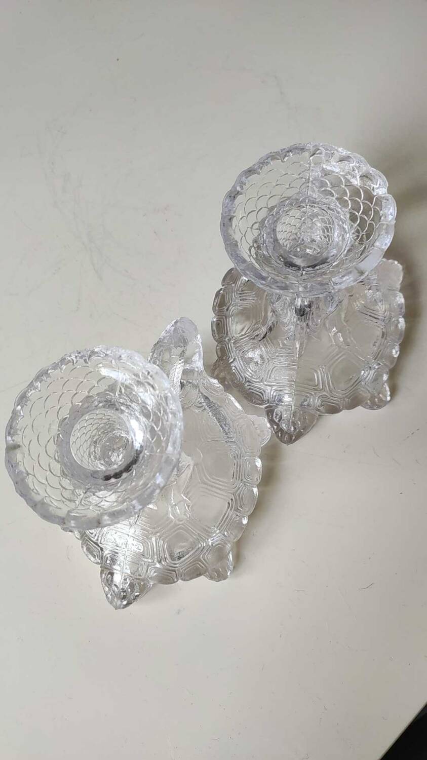 Pair of hand candlesticks/glassware from Portieux/Vallerysthal. In molded glass. Zoomorphic form of turtle carrying a griffin on its back.