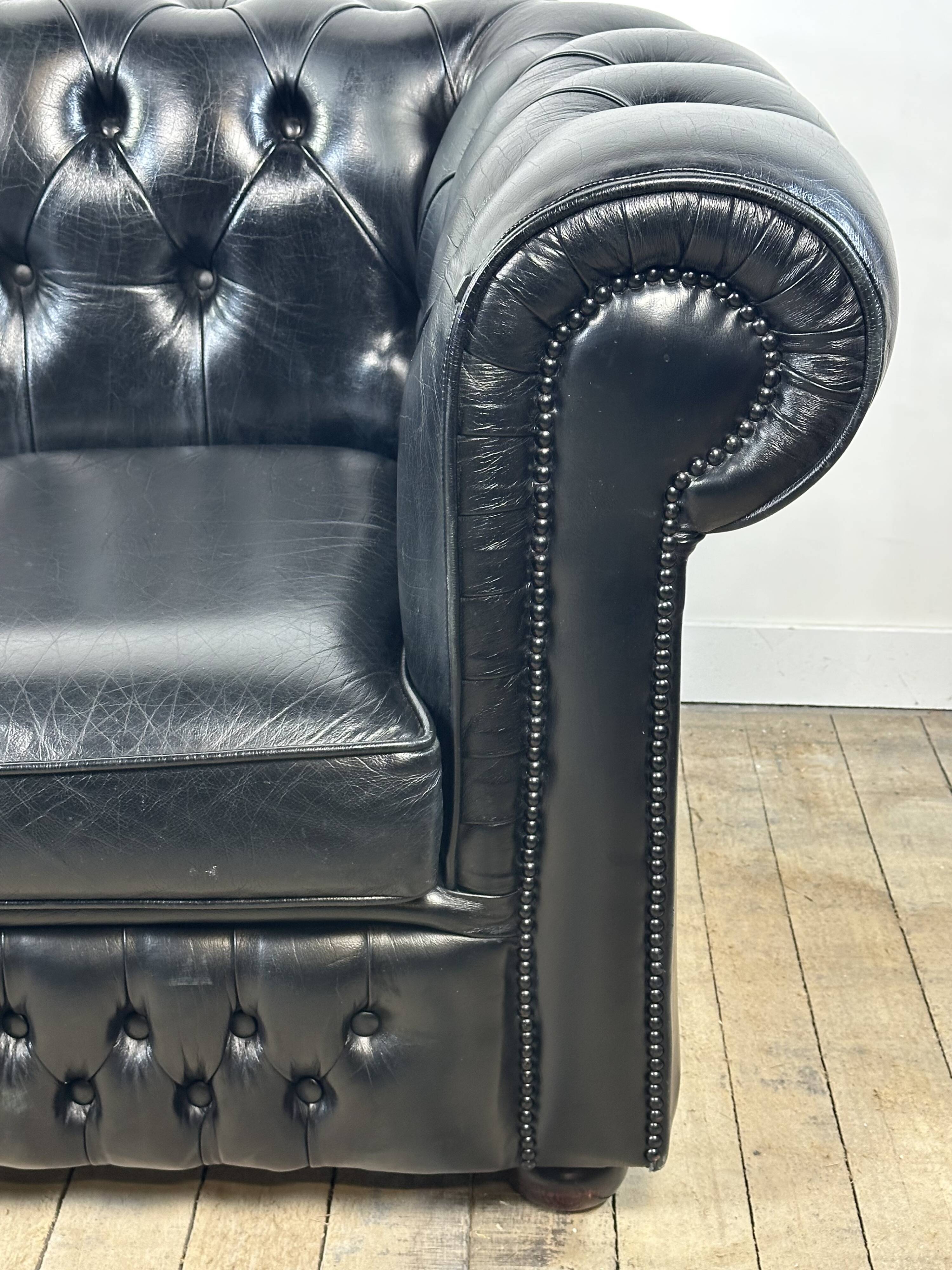 Vintage 1980 black leather Chesterfield sofa