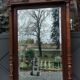 Old large carved wooden mirror