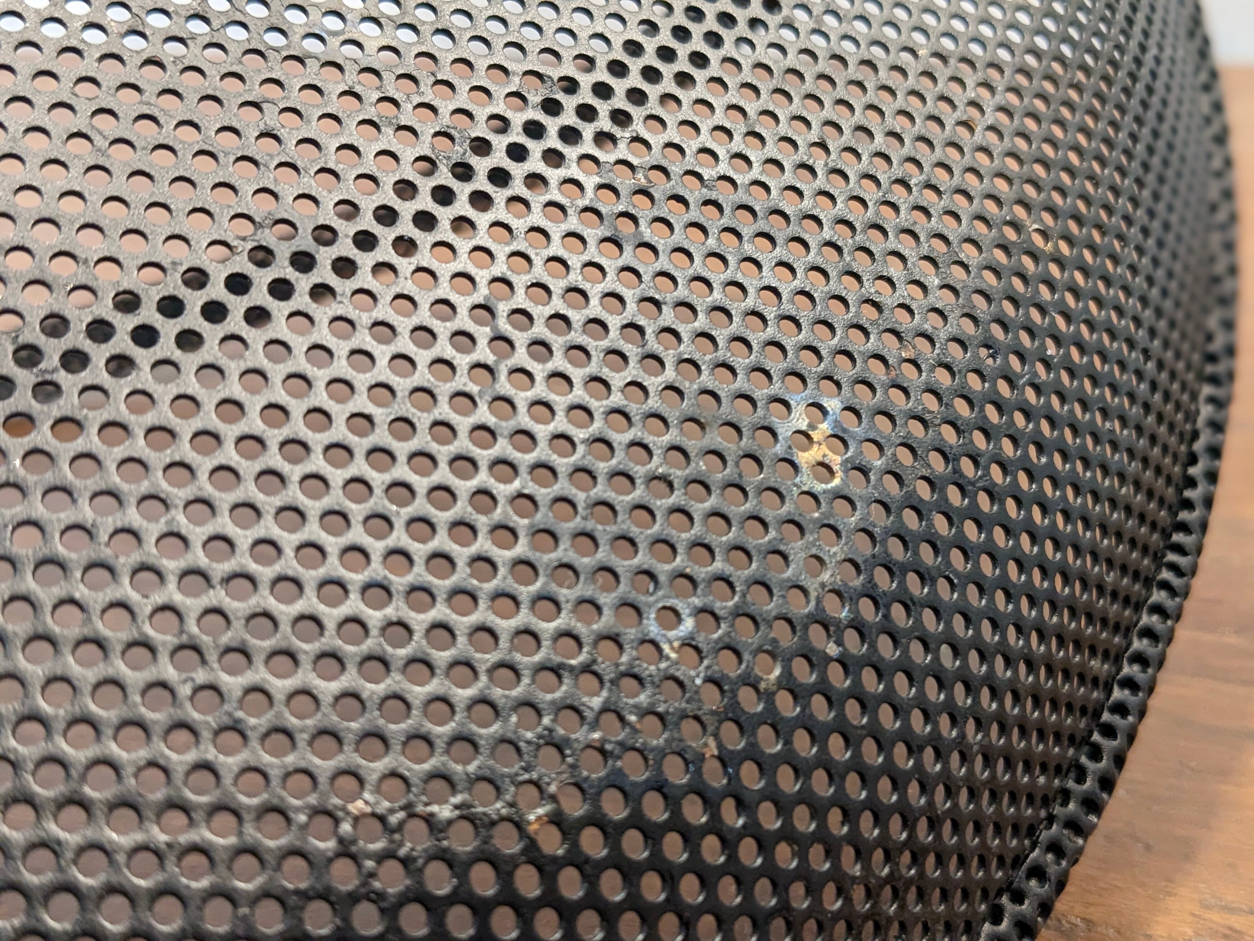 Black metal basket by Mathieu Mategot