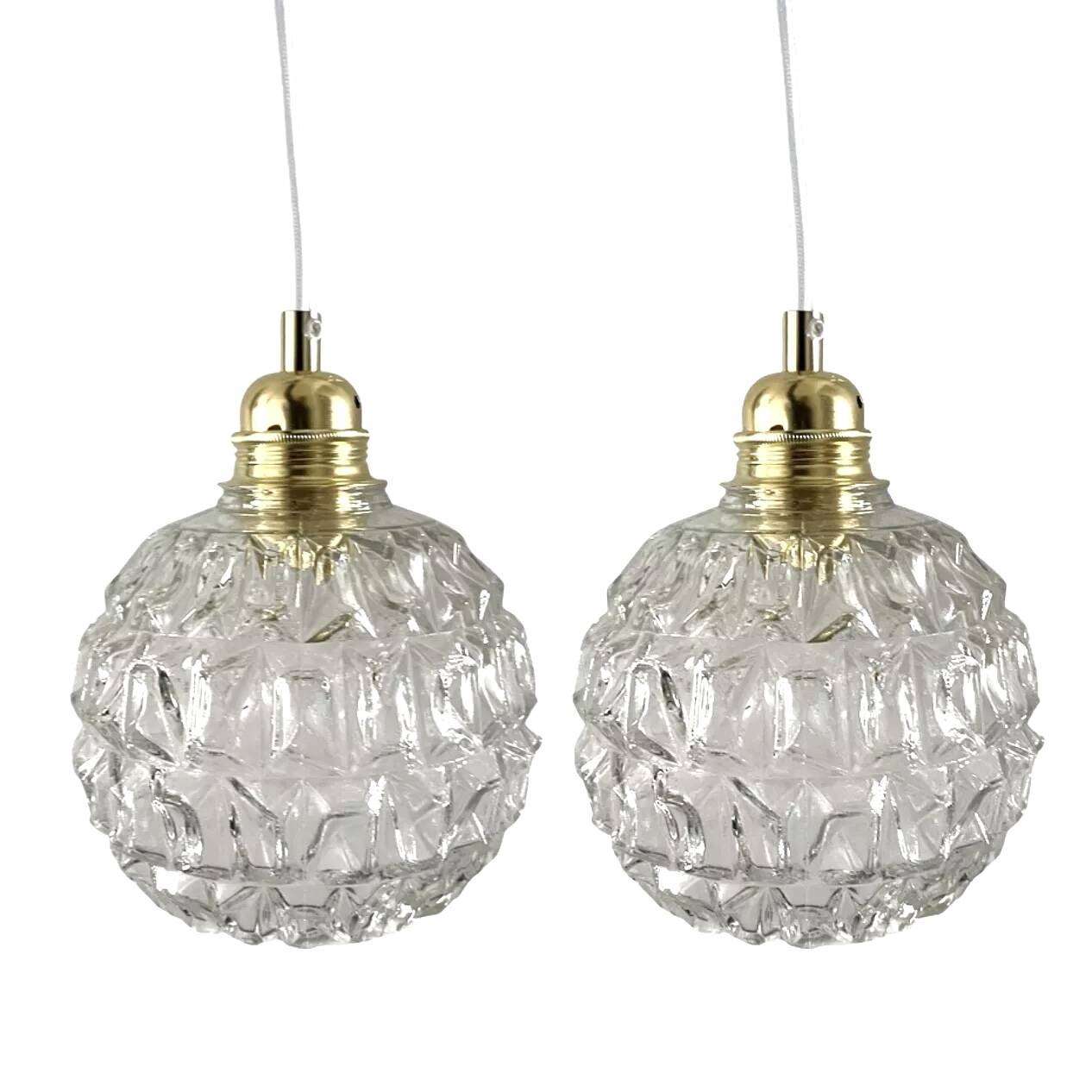 Set of two chiseled glass pendant lights