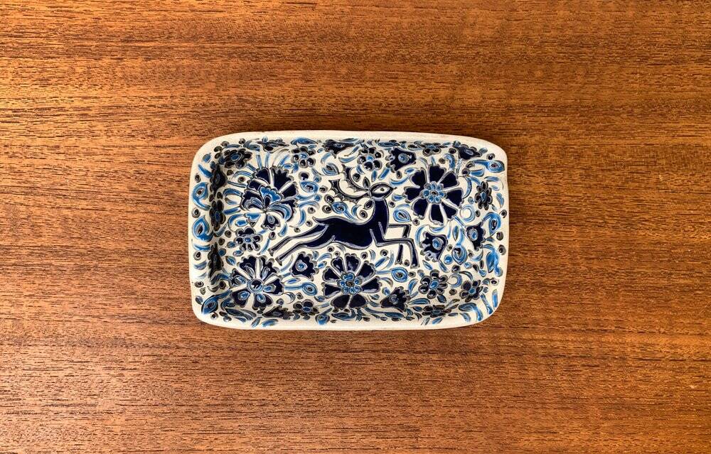 Vintage handmade blue ceramic ashtray with deer and flower ornament from Rodos Ceramics.