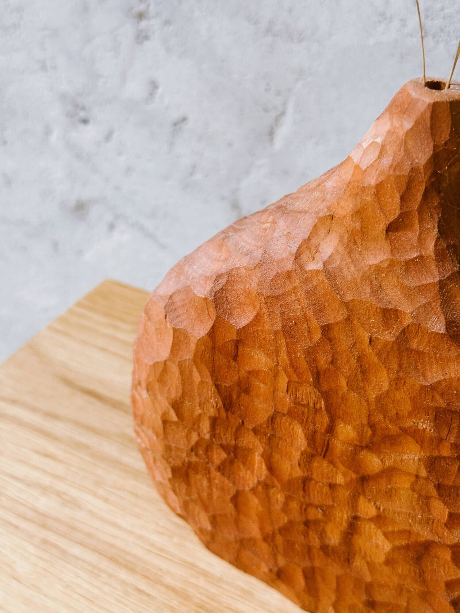 Hand-carved soliflore vase in solid cherry wood.