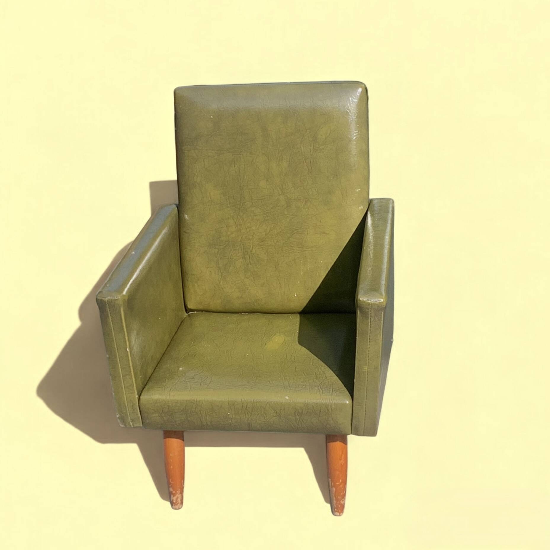 Vintage children's armchair in green skai