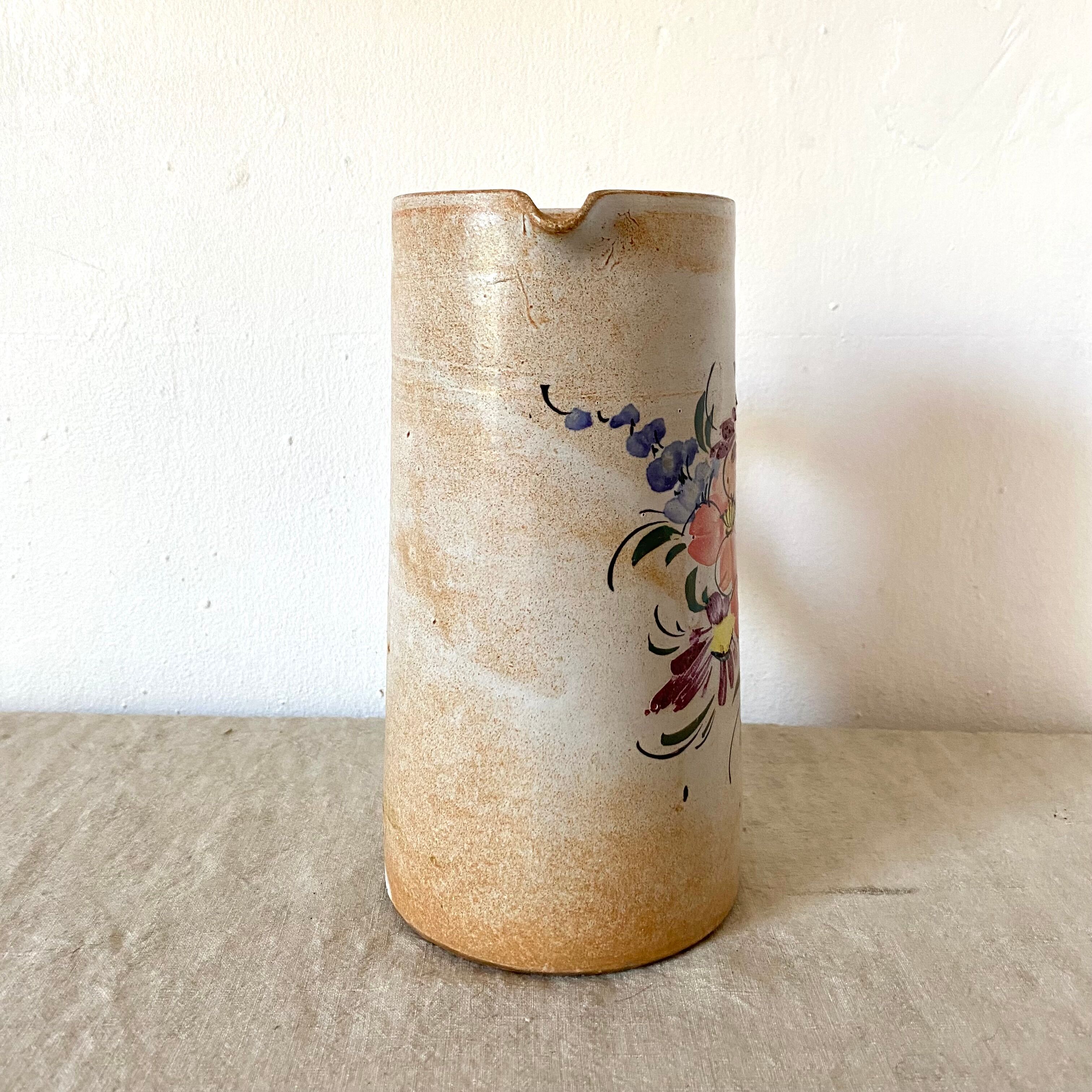 Stoneware pitcher with floral decoration