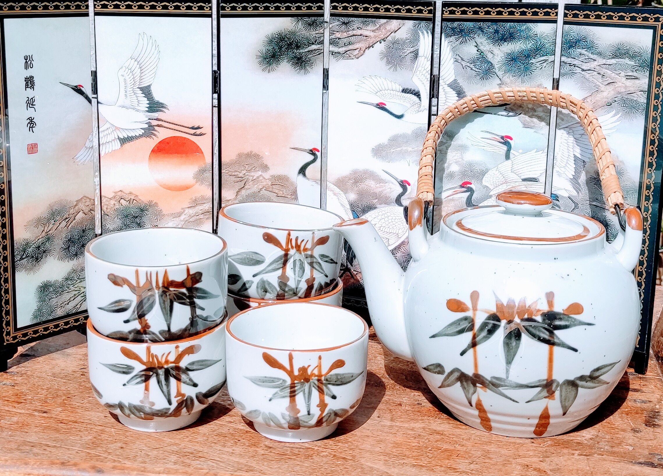 Asian set of a teapot and its cups