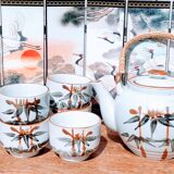 Asian set of a teapot and its cups