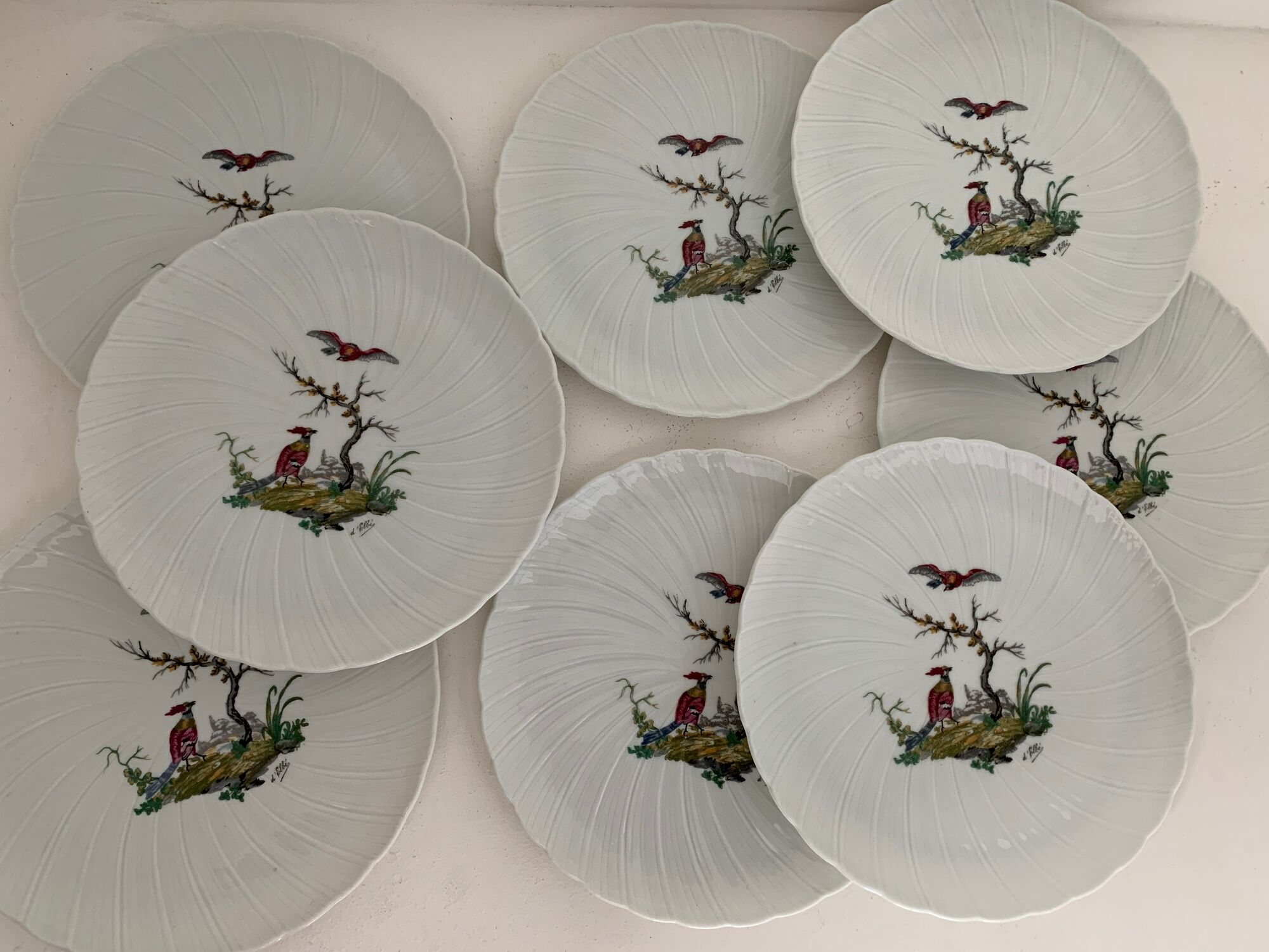 8 Bernardaud and Co. dessert plates signed Elbé, Limoges porcelain, decorated with birds
