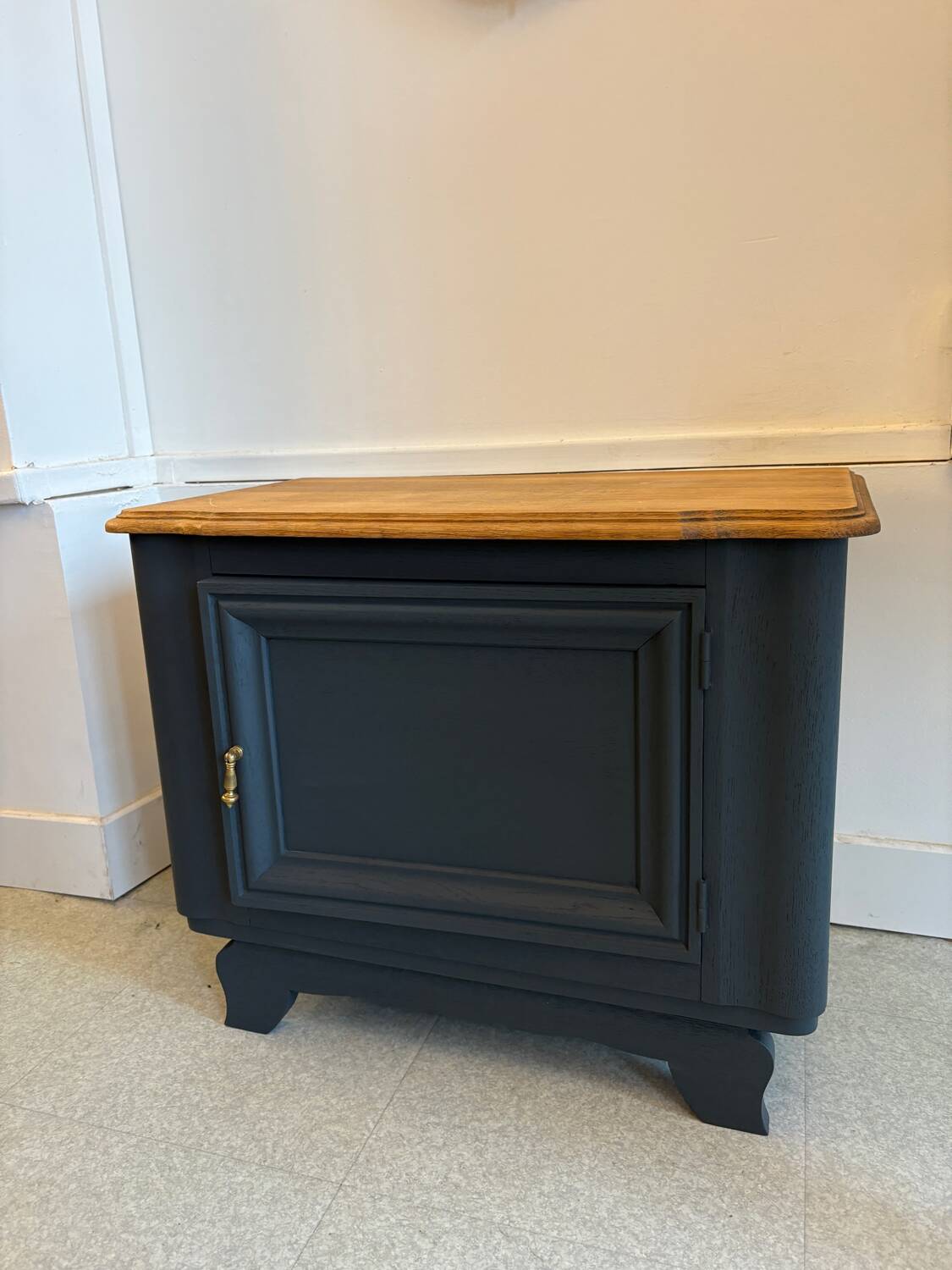 Mat black storage furniture, natural top.