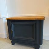 Mat black storage furniture, natural top.