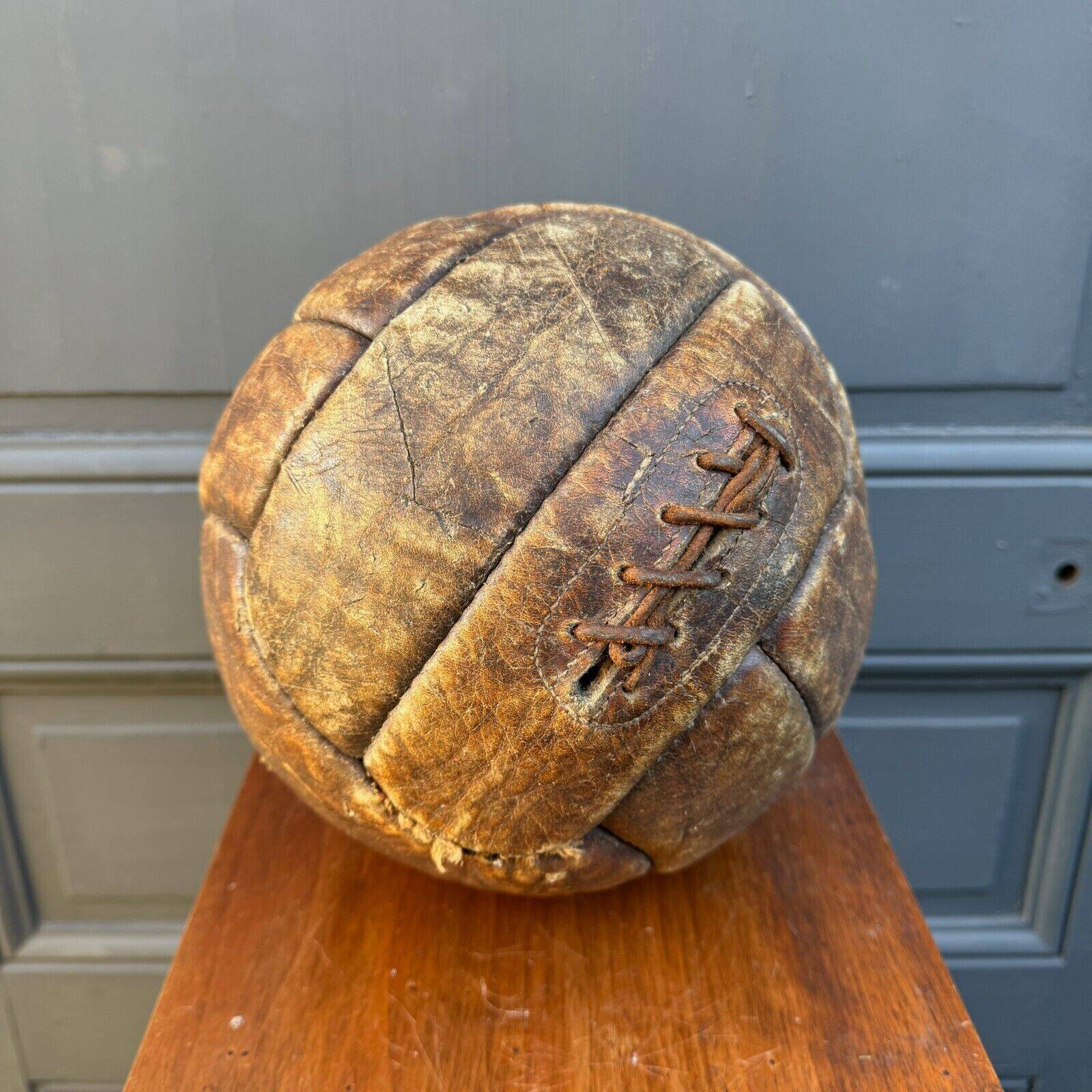 Mid-20th century leather soccer ball with visible stitching and beautiful patina