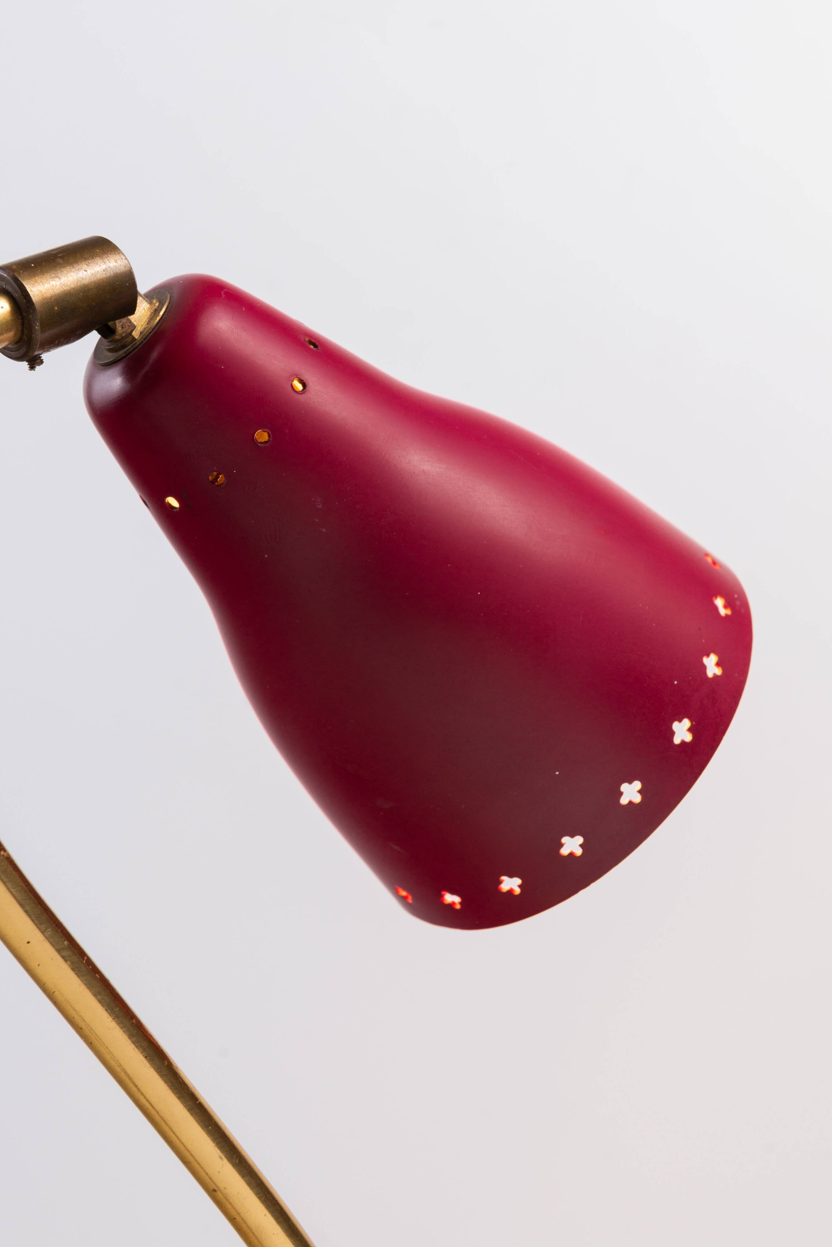 Brass wall lamp with perforated metal shade, 1950s, Sweden