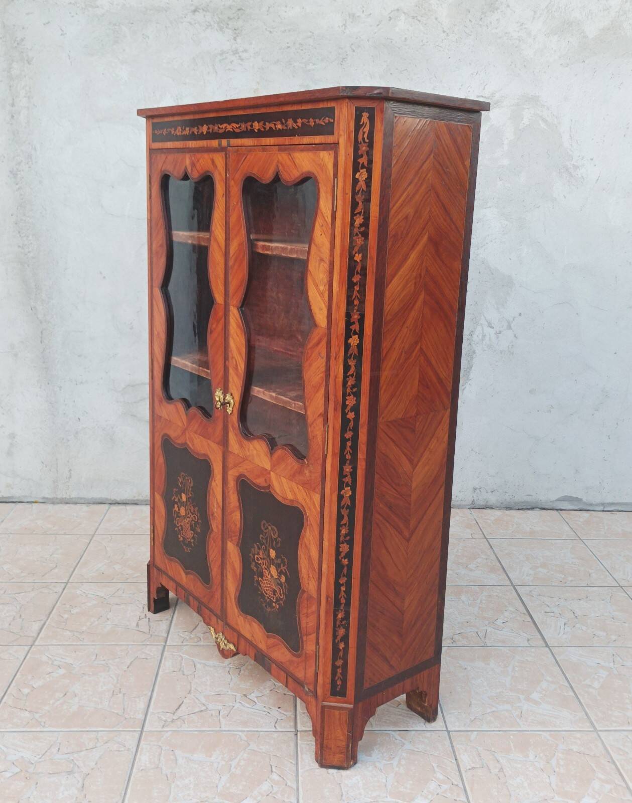 Louis XVI glass-fronted library in rosewood and amaranth veneer.