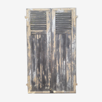 Pair of old shutters with louvers