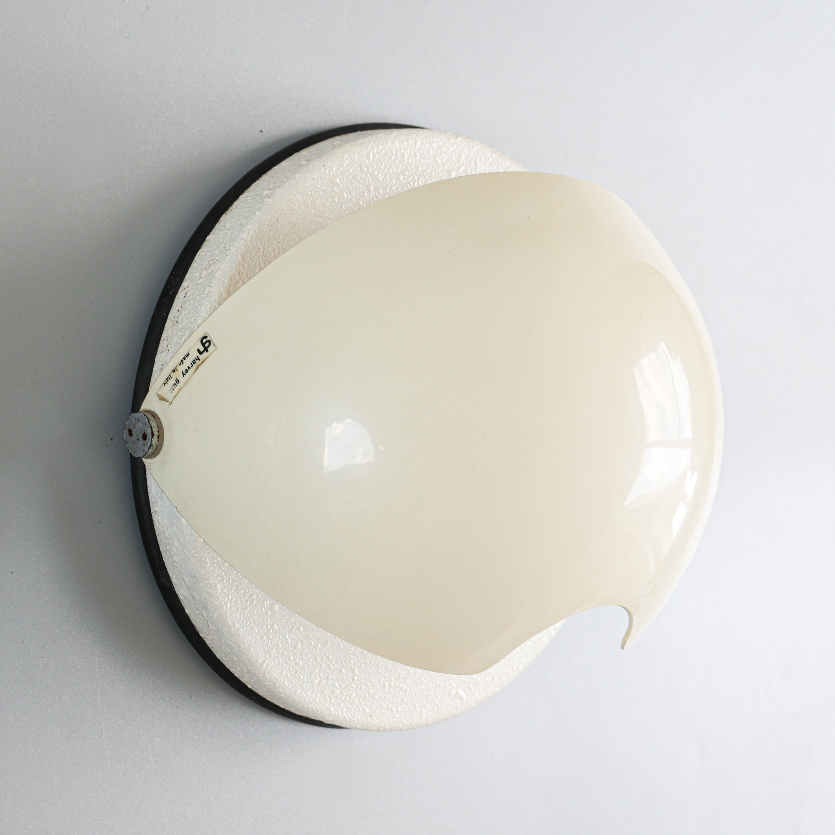 Vintage Harvey Guzzini 'Mezzanotte' sconce, 1970s.
