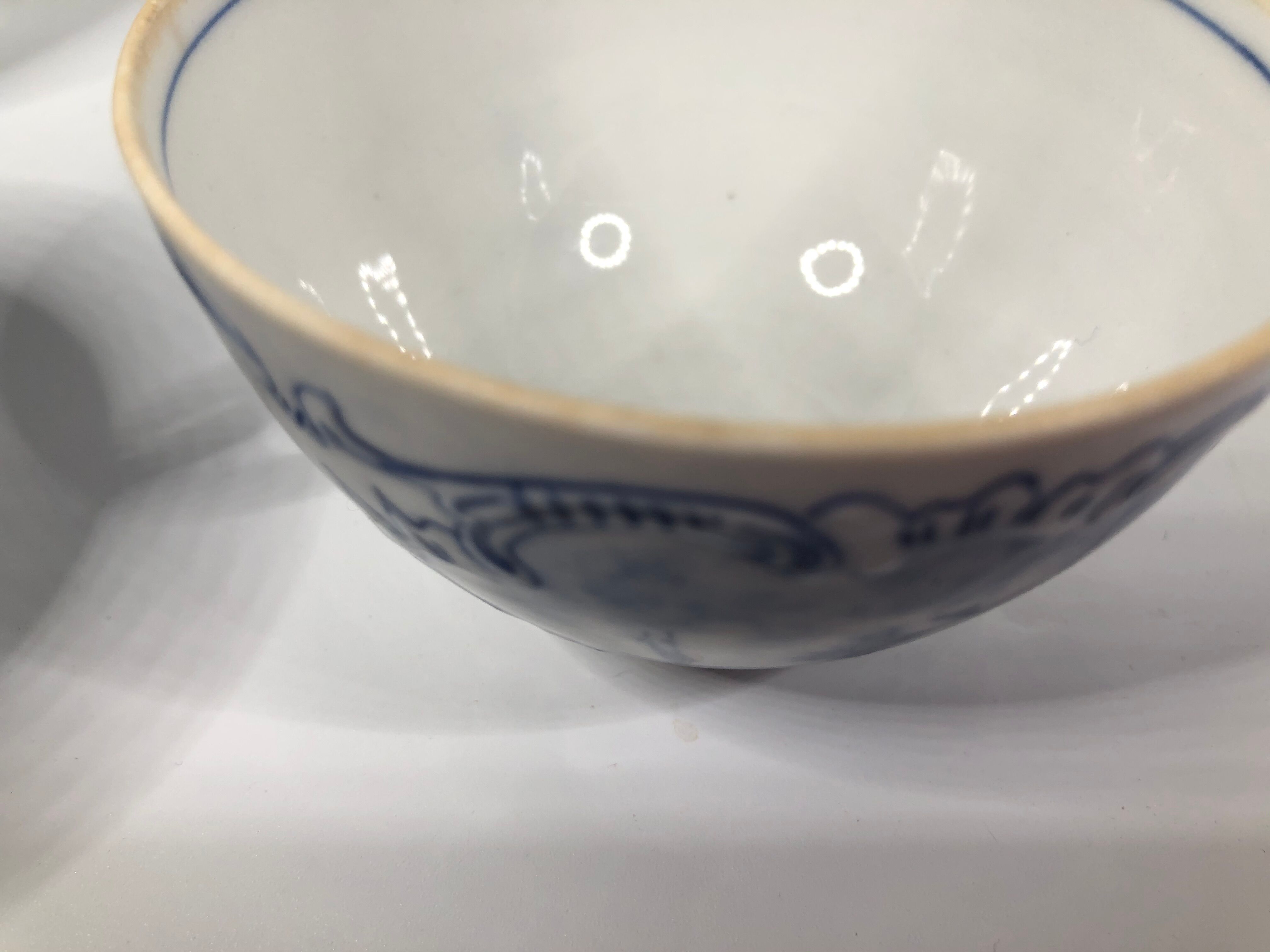 4 old cups and under Rauenstein Delft cups