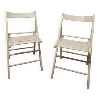 Pair of white wooden folding chairs
