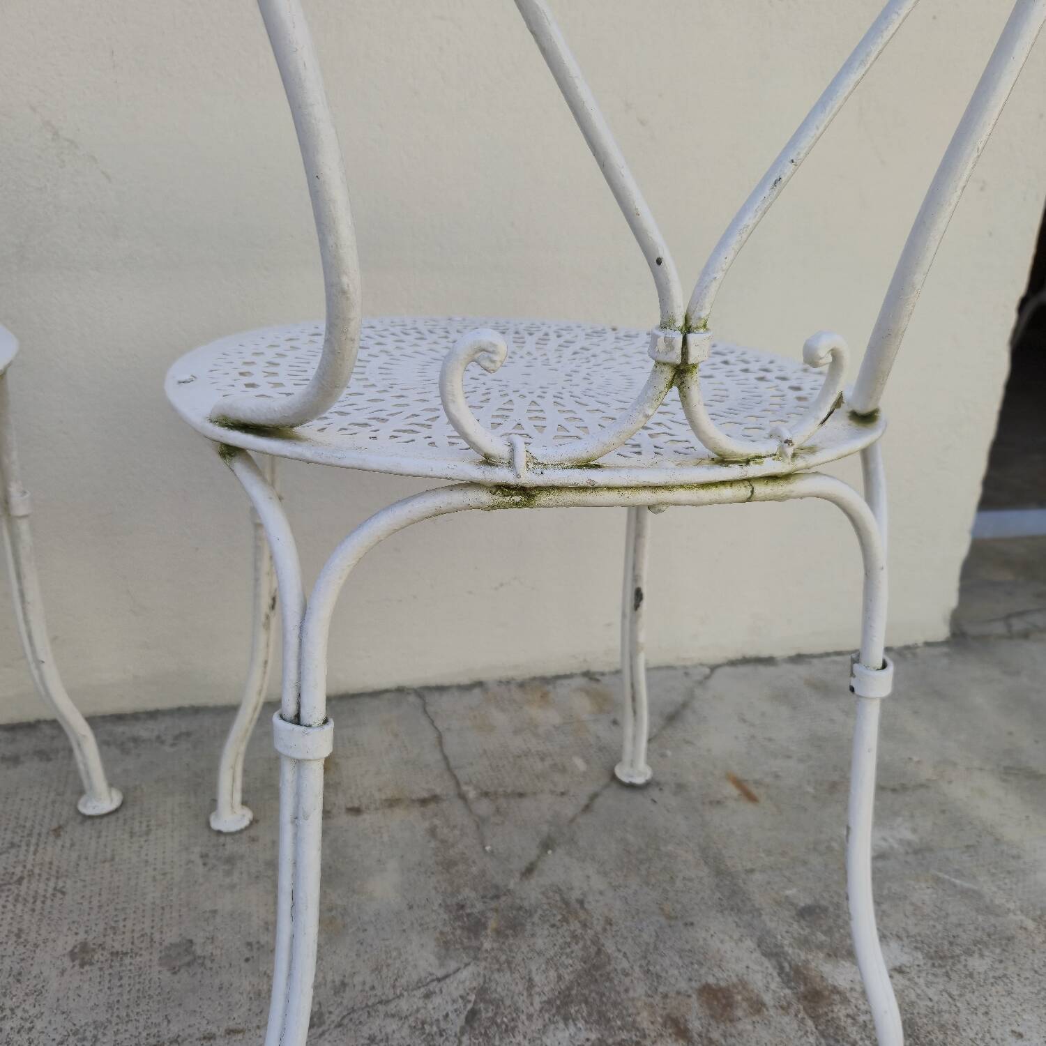 Pair of wrought iron garden chairs, antique manufacture