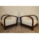 Pair of modernist armchairs in wood and buckle fabric, 1940