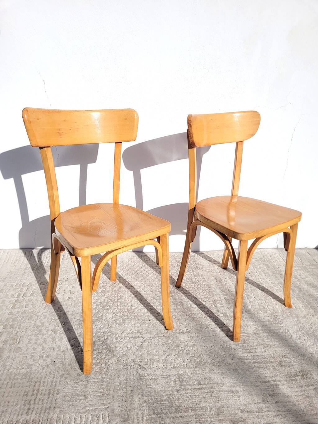 Pair of vintage bistro chairs in golden oak.