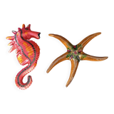 Two vintage ceramic wall pots featuring a seahorse and a starfish.