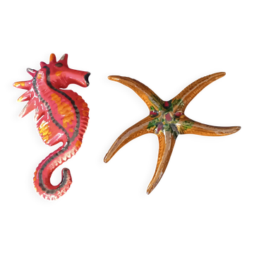 Two vintage ceramic wall pots featuring a seahorse and a starfish.