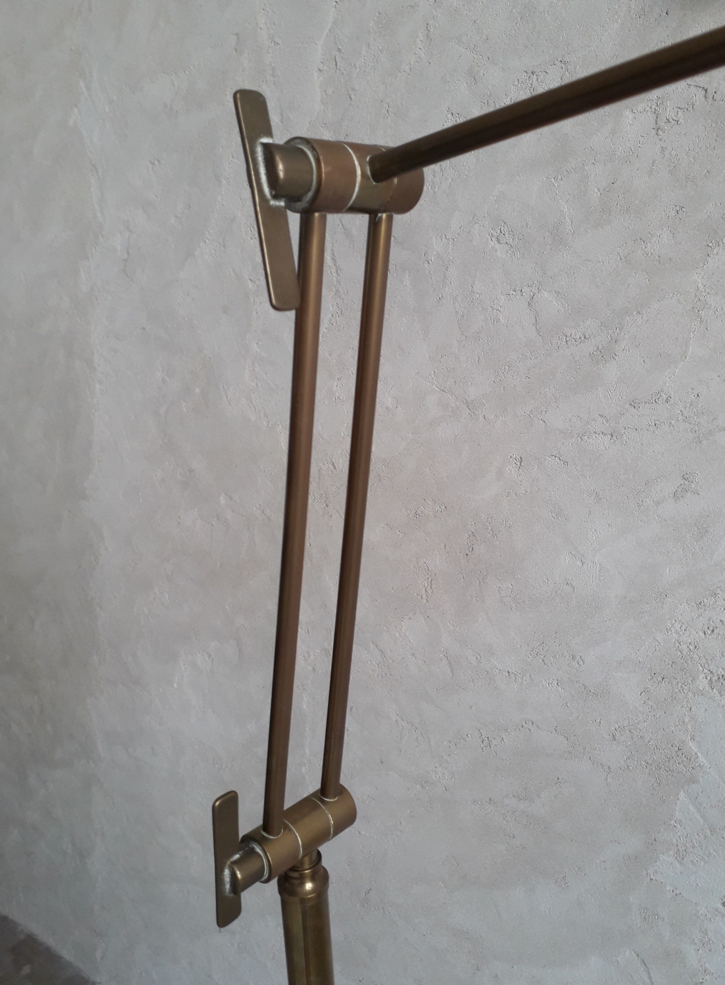 Articulated brass floor lamp