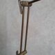 Articulated brass floor lamp